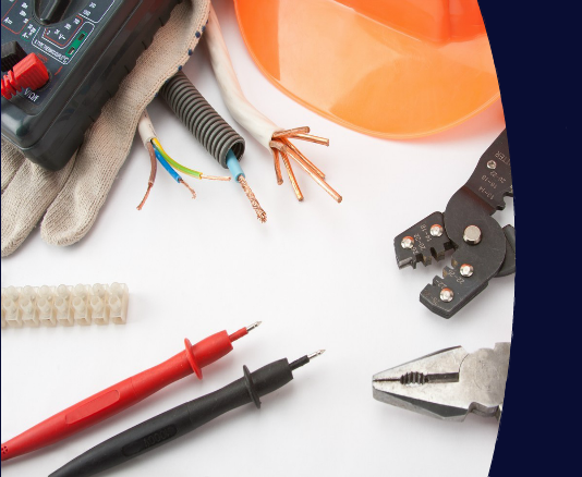 eelctrical testing equipment, wire cutters and a hard hat